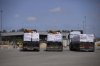 Trucks carrying humanitarian aid for the Gaza Strip are seen at the Kerem Shalom Crossing in southern Israel, Monday, May 19, 2025. A day after Israel said it would resume allowing aid into the territory. (AP Photo/Ohad Zwigenberg)