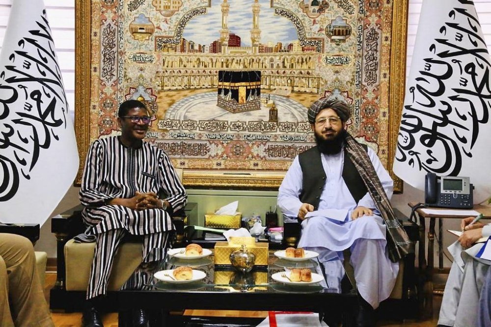 Fazl Mohammad Haqqani, the acting head of the embassy of Afghanistan in Tehran, right, meets Burkina Faso ambassador to Iran Mohammad Kabore, at the embassy of Afghanistan in Tehran, Tuesday, May 13, 2025. (Afghan Embassy in Tehran via AP)