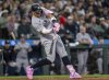 New York Yankees' Aaron Judge hits a solo home run during the eighth inning of a baseball game against the Seattle Mariners, Wednesday, May 14, 2025, in Seattle. (AP Photo/Stephen Brashear)