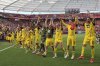 Dortmund's players celebrate in front of their fans after the German Bundesliga soccer match between Bayer 04 Leverkusen and Borussia Dortmund in Leverkusen, Germany, Sunday, May 11, 2025. (Rolf Vennenbernd/dpa via AP)