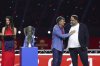 Olympiakos head coach José Luis Mendilibar, second from right, acknowledges club owner Evangelos Marinakis, right, after winning the Greek Super League championship for the 2024-2025 period at Georgios Karaiskakis Stadium in Piraeus port city of Athens, Greece, Sunday, May 4, 2025. (AP Photo/Yorgos Karahalis)