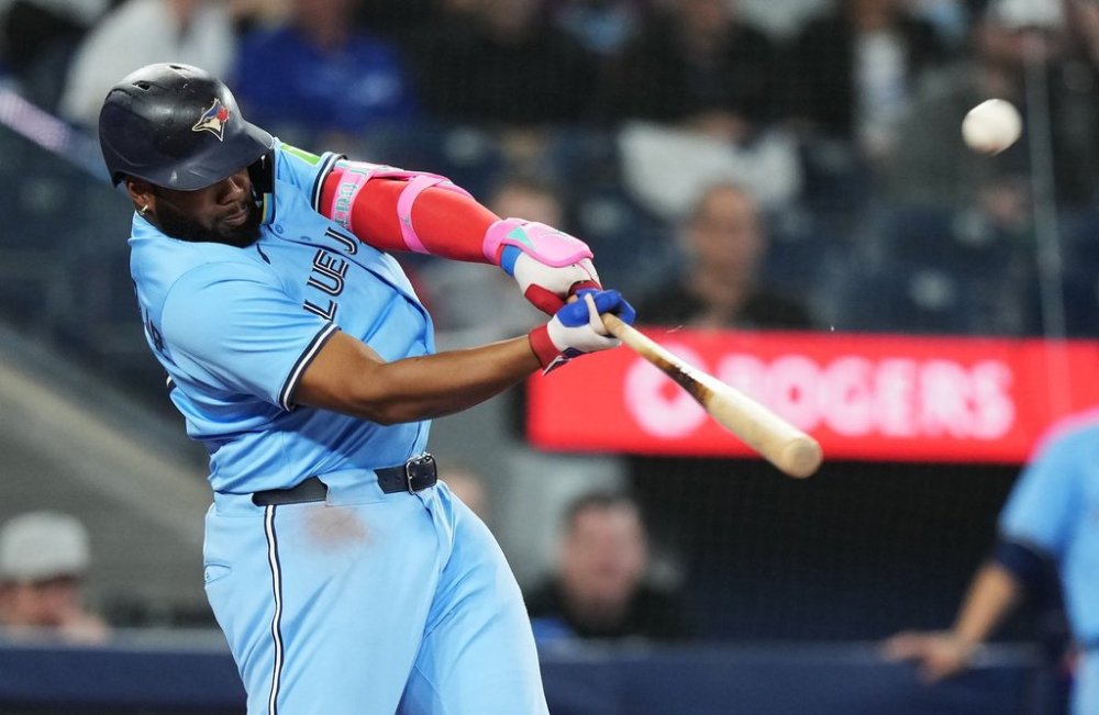 Blue Jays slugger Vladimir Guerrero Jr. (27) hits a two-run home run against the Athletics in the second inning of a Major League Baseball game in Toronto on Thursday, May 29, 2025. THE CANADIAN PRESS/Nathan Denette
