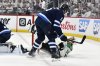 Dallas Stars' Sam Steel (18) is checked to the ice by Winnipeg Jets' Luke Schenn (5) during first period NHL playoff hockey action in Winnipeg, Thursday, May 15, 2025. THE CANADIAN PRESS/Fred Greenslade