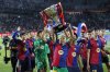 Barcelona's Raphinha lifts the trophy during celebration of winning the La Liga after the Spanish La Liga soccer match between Barcelona and Villarreal at Lluis Companys Olympic Stadium in Barcelona, Spain, Sunday, May 18, 2025. (AP Photo/Joan Monfort)
