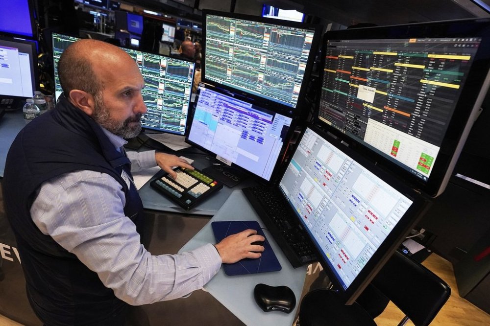 Specialist James Denaro works at his post on the floor of the New York Stock Exchange, Wednesday, May 14, 2025. (AP Photo/Richard Drew)