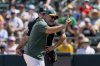Athletics manager Mark Kotsay, front, argues with umpire Roberto Ortiz, back, after being ejected during the seventh inning of a baseball game against the Philadelphia Phillies, Sunday, May 25, 2025, in West Sacramento, Calif. (AP Photo/Sara Nevis)