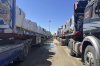 FILE.- Trucks line up at the Egyptian side of the Rafah border crossing between Egypt and the Gaza Strip after Israel blocked the entry of aid trucks into Gaza, Sunday, March 2, 2025. (AP Photo/Mohamed Arafat,File)