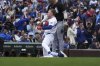 Chicago Cubs' Pete Crow-Armstrong, center front, celebrates after hitting a triple during the first inning of a baseball game against the Chicago White Sox in Chicago, Sunday, May 18, 2025. (AP Photo/Nam Y. Huh)