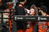 Baltimore Orioles' Jackson Holliday, center, wears a hat and drinks out of the 