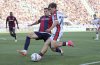 Genoa's Lorenzo Venturino, right, fights for the ball with Bologna's Nicolo' Casale during the Serie A soccer match between Bologna and Genoa, at the Renato Dall'Ara Stadium, in Bologna, Italy, Saturday, May 24, 2025. (Michele Nucci/LaPresse via AP)