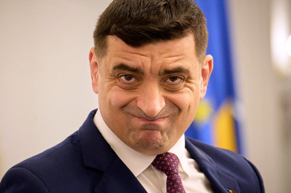 Presidential candidate George Simion waits to address members of the business community at the Chamber of Commerce and Industry of Romania, days ahead of the second round of the presidential election redo in Bucharest, Romania, Tuesday, May 13, 2025. (AP Photo/Vadim Ghirda)