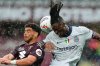 Torino's Che Adams, left, and Inter's Yann Bisseck, right, go for a header during a Serie A soccer match between FC Torino and Inter Milan in Turin, Italy, Sunday , May 11 , 2025. (Spada/LaPresse via AP)