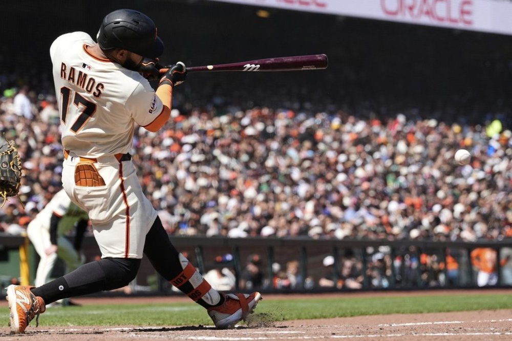 San Francisco Giants' Heliot Ramos hits an RBI single during the eighth inning of a baseball game against the Athletics, Sunday, May 18, 2025, in San Francisco. (AP Photo/Godofredo A. Vásquez)