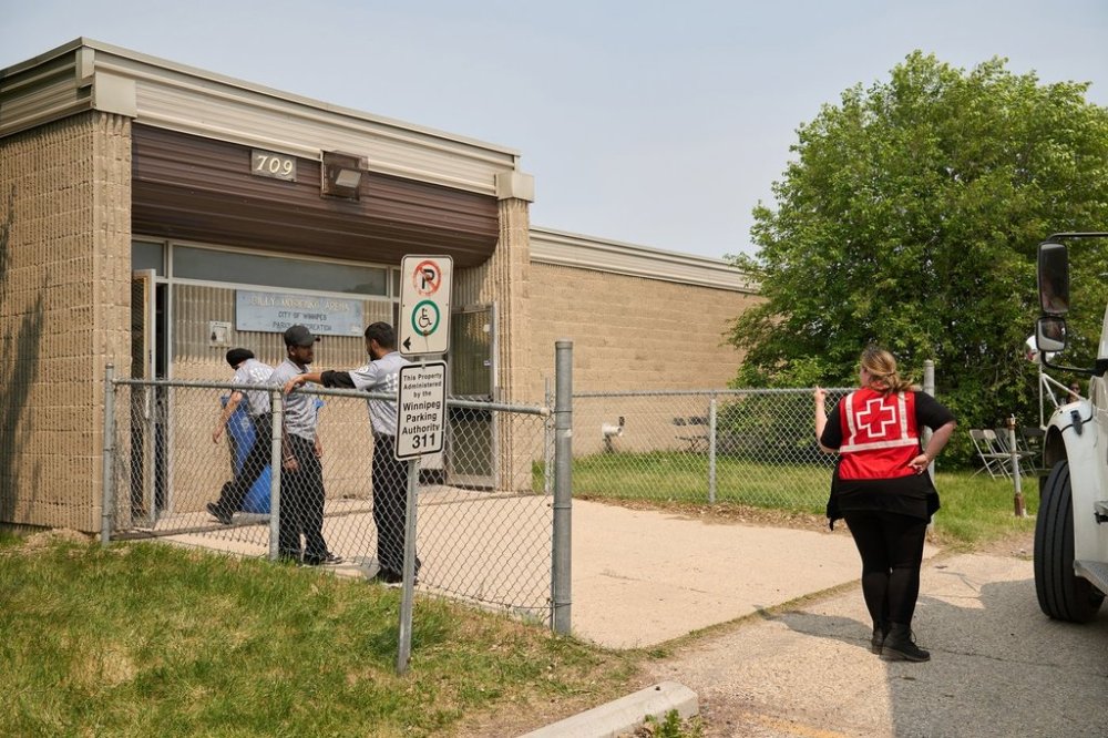 A reception centre for evacuees of the wildfires in northern Manitoba is being staffed by provincial Emergency Social Services, and the Canadian Red Cross at the Billy Mosienko Arena in Winnipeg, Thursday, May 29, 2025. THE CANADIAN PRESS/David Lipnowski
