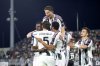 Juventus' Randal Kolo Muani, left, celebrates with team-mates after scoring their side's second goal of the game during the Serie A soccer match between Venezia and Juventus at the Pier Luigi Penzo Stadium, in Venice, Italy, Sunday, May 25, 2025. (Paola Garbuio/LaPresse via AP)