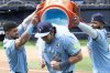 Toronto Blue Jays Addison Barger, centre, is doused by teammates Janatan Clase, left and Vladimir Guerrero Jr to celebrate their team's defeat of the Athletics in MLB baseball action in Toronto on Sunday, June 1, 2025. THE CANADIAN PRESS/Jon Blacker