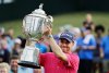 FILE - Justin Thomas poses with the Wanamaker Trophy after winning the PGA Championship golf tournament at the Quail Hollow Club Sunday, Aug. 13, 2017, in Charlotte, N.C. (AP Photo/Chris O'Meara, File)