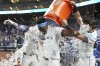 Miami Marlins' Jesus Sanchez is doused with ice after hitting a walk-off triple to defeat the Chicago Cubs in a baseball game Monday, May 19, 2025, in Miami. (AP Photo/Lynne Sladky)