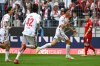 Cologne's Eric Martel, second left, celebrates after scoring the first goal of the game during the German Bundesliga 2 soccer match between 1. FC Cologne and 1. FC Kaiserslautern at RheinEnergieStadion in Cologne, Germany, Sunday May 18, 2025. (Federico Gambarini/dpa via AP)