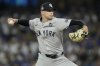 FILE - New York Yankees pitcher Jake Cousins throws against the Los Angeles Dodgers during the fourth inning in Game 2 of the baseball World Series, Saturday, Oct. 26, 2024, in Los Angeles. (AP Photo/Ashley Landis, File)
