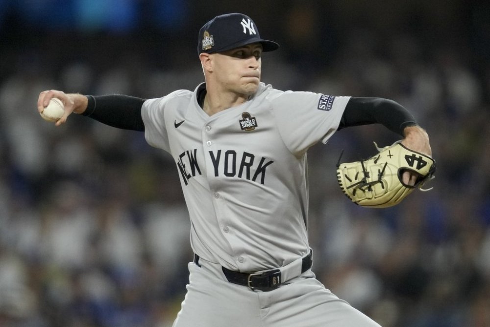 FILE - New York Yankees pitcher Jake Cousins throws against the Los Angeles Dodgers during the fourth inning in Game 2 of the baseball World Series, Saturday, Oct. 26, 2024, in Los Angeles. (AP Photo/Ashley Landis, File)