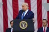 U.S. President Donald Trump delivers the Memorial Day Address at the 157th National Memorial Day Observance at Arlington National Cemetery, Monday in Arlington, Va., as Vice President JD Vance and Secretary of Defense Pete Hegseth, right, look on. (AP Photo/Julia Demaree Nikhinson)
