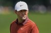 Scottie Scheffler reacts after the 16th hole during the first round of the PGA Championship golf tournament at the Quail Hollow Club, Thursday, May 15, 2025, in Charlotte, N.C. (AP Photo/David J. Phillip)