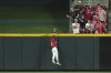 Cincinnati Reds' TJ Friedl catches a fly ball at the wall to end the game in the ninth inning of a baseball game against the Milwaukee Brewers, Tuesday, June 3, 2025, in Cincinnati. (AP Photo/Kareem Elgazzar)
