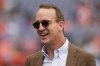 FILE - Hall of Fame quarterback Peyton Manning looks on before an NFL football game between the Denver Broncos and the Carolina Panthers, Oct. 27, 2024, in Denver. (AP Photo/Jack Dempsey, File)
