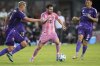 Inter Miami forward Lionel Messi (10) comes under pressure from Orlando City defender Robin Jansson (6) and midfielder Cesar Araujo (5) during the first half of an MLS soccer match, Sunday, May 18, 2025, in Fort Lauderdale, Fla. (AP Photo/Rebecca Blackwell)