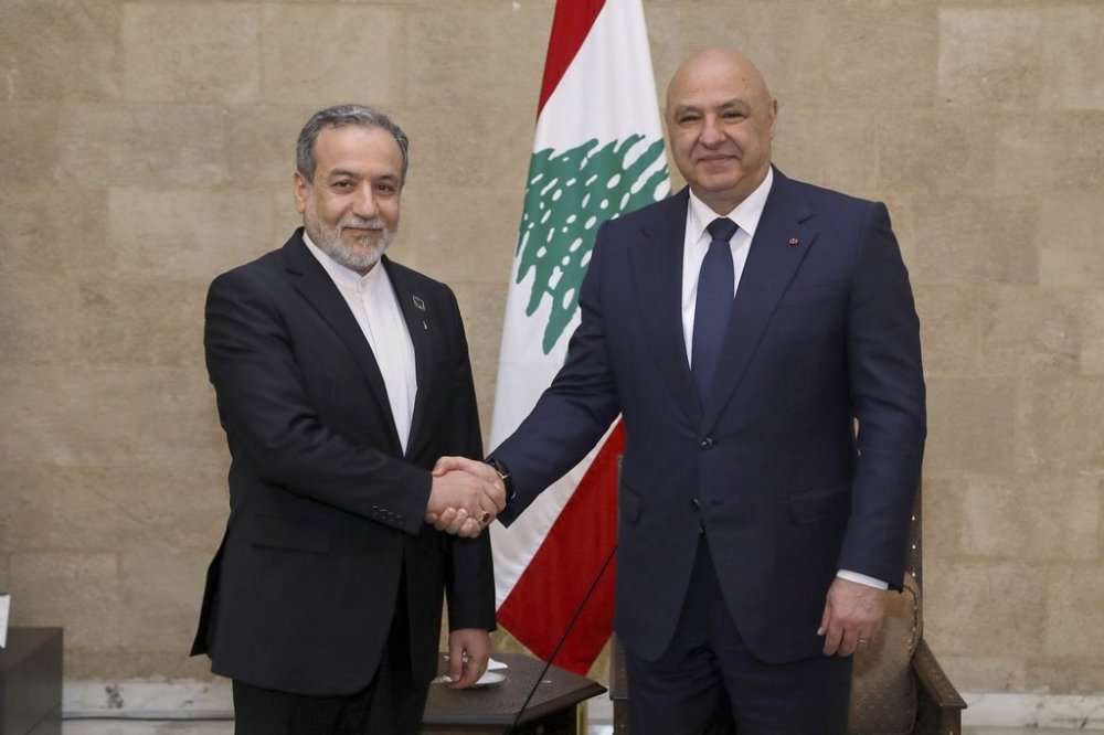 In this photo released by the Lebanese Presidency press office, Lebanese president Joseph Aoun, right, shakes hands with Iranian Foreign Minister Abbas Araghchi in Baabda, east of Beirut, Lebanon, Tuesday, June 3, 2025. (Lebanese Presidency press office via AP)