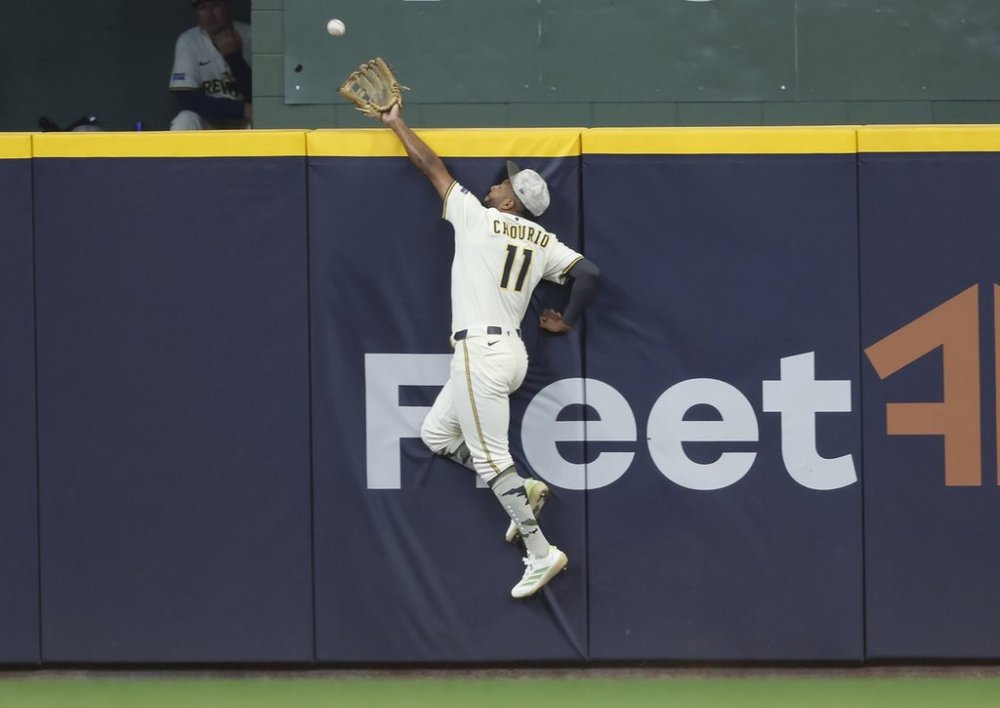 Milwaukee Brewers outfielder Jackson Chourio catches a ball hit by Minnesota Twins' Royce Lewis during the eighth inning of a baseball game, Sunday, May 18, 2025, in Milwaukee. (AP Photo/Jeffrey Phelps)