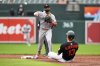 Baltimore Orioles' Heston Kjerstad (13) is forced out by Minnesota Twins second baseman Willi Castro (50), throwing to first baseman Kody Clemens for the double play, during the second inning in the second baseball game of a doubleheader, Wednesday, May 14, 2025, in Baltimore. (AP Photo/Stephanie Scarbrough)
