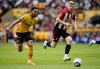 Wolverhampton Wanderers' Matheus Cunha and Brentford's Nathan Collins, right, in action during the English Premier League soccer match between Wolverhampton Wanderers and Brentford at Molineux Stadium, Wolverhampton, England, Sunday May 25, 2025. (Nick Potts/PA via AP)