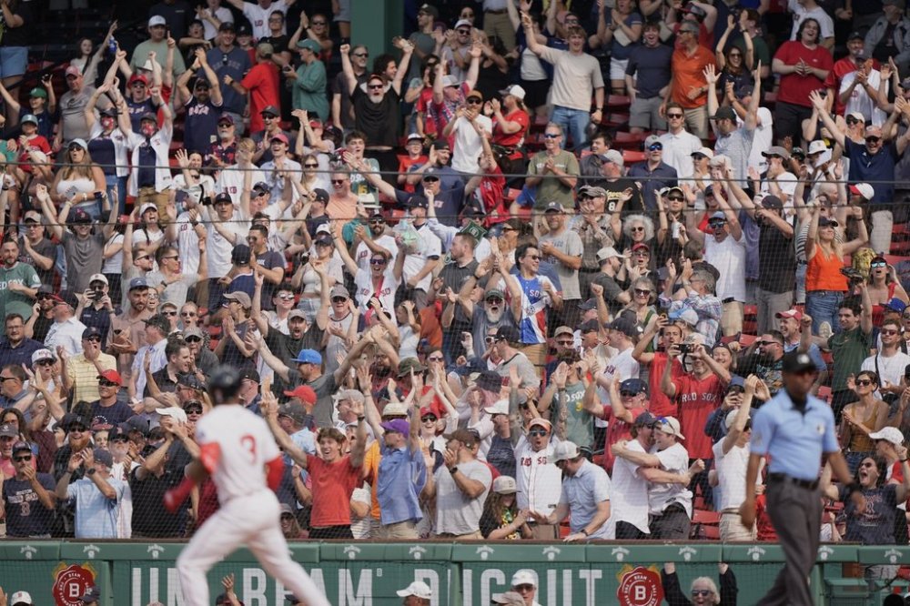 Fans rejoice after a walk off home run by Boston Red Sox's Ceddanne Rafaela (3) in the ninth inning of a baseball game against the Los Angeles Angels, Wednesday June 4, 2025, in Boston. (AP Photo/Robert F. Bukaty)
