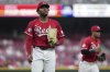Cincinnati Reds' Hunter Greene walks to the dugout in the fifth inning of a baseball game against the Milwaukee Brewers, Tuesday, June 3, 2025, in Cincinnati. (AP Photo/Kareem Elgazzar)
