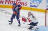Oilers winger Kasperi Kapanen (42) tries to redirect the puck as Florida Panthers goalie Sergei Bobrovsky (72) makes the save in Game 1 of Stanley Cup final in Edmonton on Wednesday, June 4, 2025. THE CANADIAN PRESS/Darryl Dyck