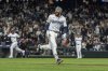 Seattle Mariners' J.P. Crawford celebrates after hitting and RBI-single during the eleventh inning of a baseball game against the New York Yankees, Tuesday, May 13, 2025, in Seattle. (AP Photo/Stephen Brashear)