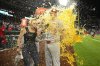 St. Louis Cardinals starting pitcher Erick Fedde, right, is doused during an interview after a baseball game against the Washington Nationals, Friday, May 9, 2025, in Washington. (AP Photo/Nick Wass)