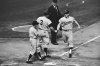 Minnesota Twins' Rich Rollins, right, is greeted at home plate after hitting a home run during a baseball game against the New York Yankees in New York, June 26, 1962. (AP Photo/Matty Zimmerman, File)