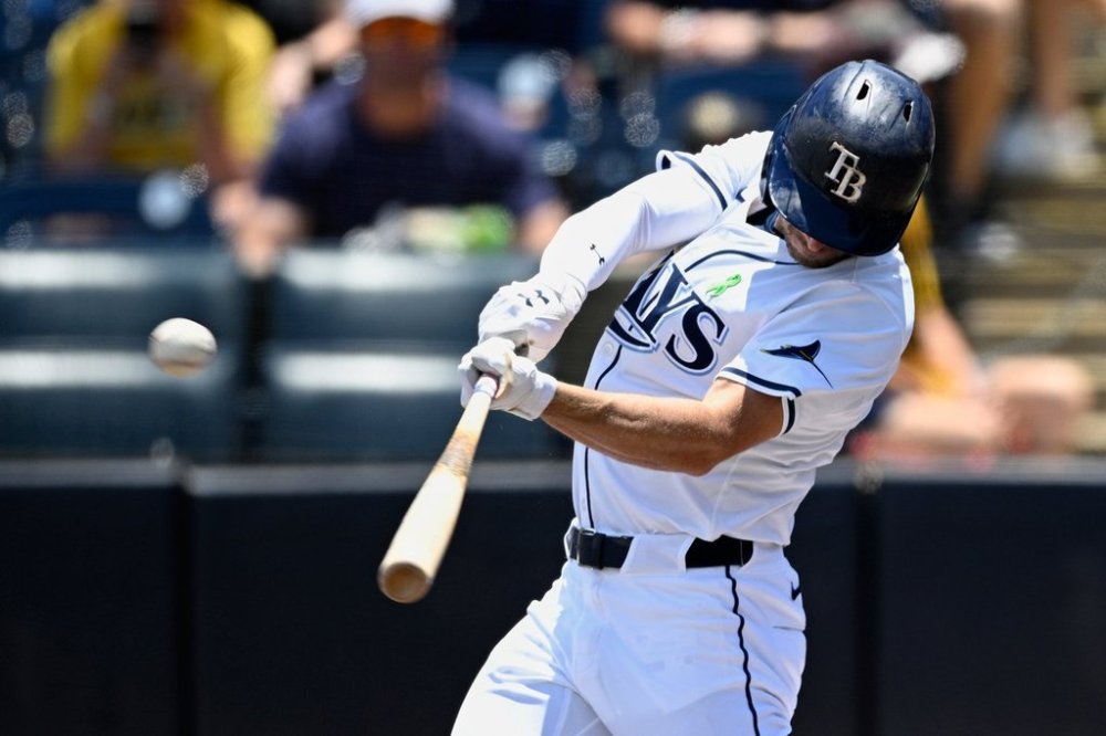 Tampa Bay Rays' Brandon Lowe hits a two-run home run in the during the first inning of a baseball game against the Toronto Blue Jays, Sunday, May 25, 2025, in Tampa, Fla. (AP Photo/Phelan M. Ebenhack)