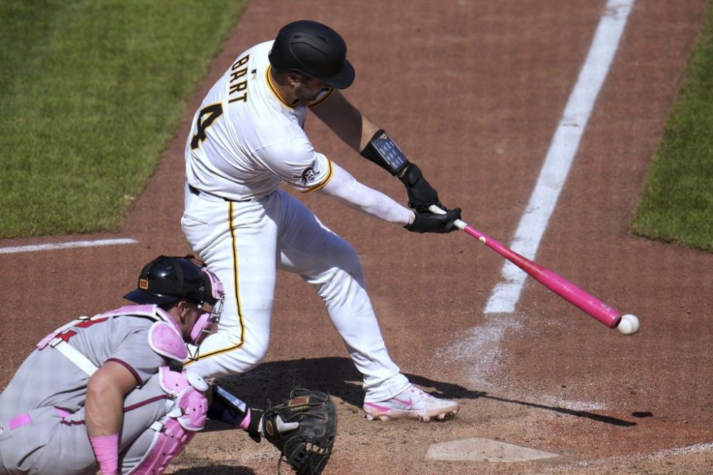 Pittsburgh Pirates' Joey Bart singles off Atlanta Braves pitcher Raisel Iglesias, driving in the winning run, during the bottom of the ninth inning of a baseball game in Pittsburgh, Sunday, May 11, 2025. (AP Photo/Gene J. Puskar)