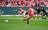 Mainz's Jonathan Burkardt, center, scores his team's second goal, during the German Bundesliga soccer match between 1. FSV Mainz 05 and Bayer Leverkusen, at the Mewa Arena, in Mainz, Germany, Saturday, May 17, 2025. (Arne Deder/dpa via AP)
