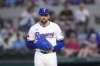 Texas Rangers starting pitcher Nathan Eovaldi looks on before making a pitch to the Toronto Blue Jays during the second inning of a baseball game Tuesday, May 27, 2025, in Arlington, Texas. (AP Photo/Julio Cortez)
