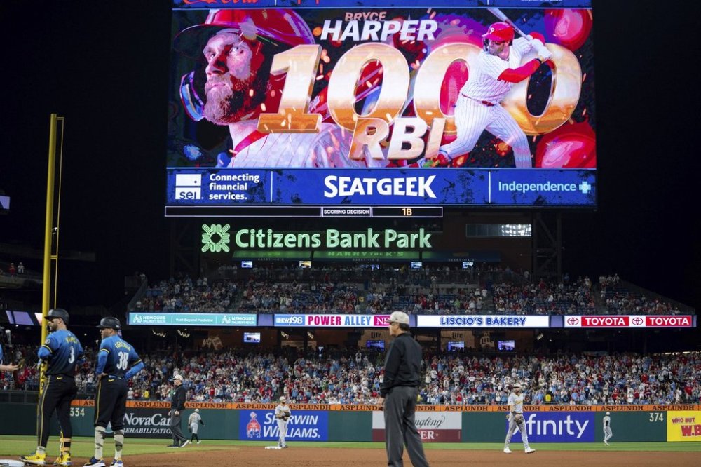 Philadelphia Phillies' Bryce Harper (3) records his 1000th RBI during the fifth inning of a baseball game against the Pittsburgh Pirates, Friday, May 16, 2025, in Philadelphia. (AP Photo/Chris Szagola)