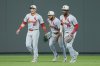 St. Louis Cardinals outfielders Lars Nootbaar (21), Victor Scott II (11) and Jordan Walker (18) celebrate after their baseball game against the Kansas City Royals, Saturday, May 17, 2025, in Kansas City, Mo. (AP Photo/Charlie Riedel)