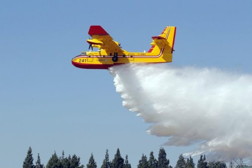A Canadian Bombardier CL-415 Super Scooper firefighting plane drops water during a demonstration for public officials at Van Nuys Airport in Los Angeles  Monday, Aug 26, 2013. THE CANADIAN PRESS/AP-Nick Ut
