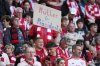 Bayern Munich fan holds placard reading 