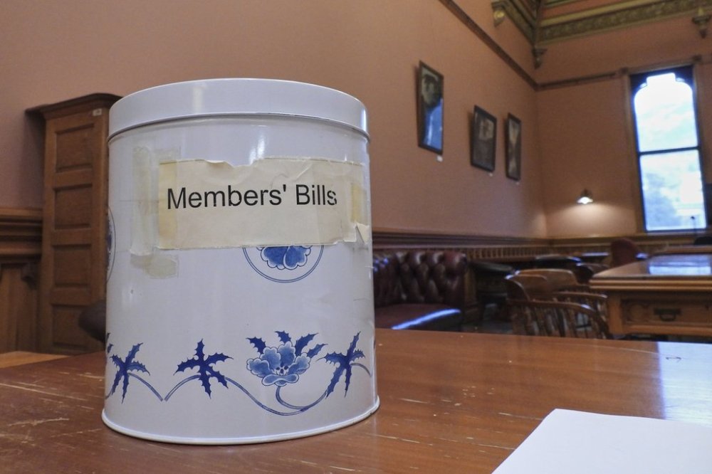 The decorative cookie tin, known in New Zealand as the biscuit tin, which was purchased from a department store in the early 1990s to draw lawmakers' bills from and remains in use, at Parliament in Wellington, New Zealand, Thursday, May 22, 2025. (AP Photo/Charlotte Graham-McLay)