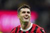 AC Milan's Christian Pulisic celebrates after scoring their second goal of the game during the Serie A soccer match between Milan and Bologna at San Siro Stadium in Milan, Italy, Friday May 9, 2025. (Spada/LaPresse via AP)